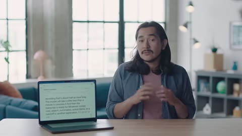 Source frame at 115.500s. Presenter and laptop remain at desk.